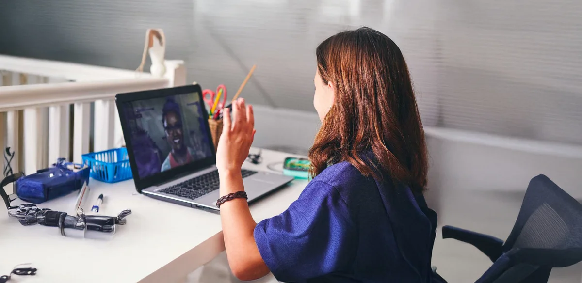 Girl saying hi to the virtual meeting